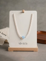 Load image into Gallery viewer, Pearl Beaded Necklace with Coloured Centre Gold-Tone Close-Up Detail — Solisita