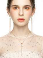 Load image into Gallery viewer, Pearl Lariat Necklace Gold On-Hand Shot — Solisita