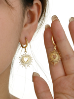 Load image into Gallery viewer, Solar Heart Earrings Gold On-Ear View — Solisita