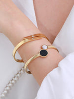 Load image into Gallery viewer, Black &amp; White Shell Geometric Bangle Gold On-Wrist Shot — Solisita
