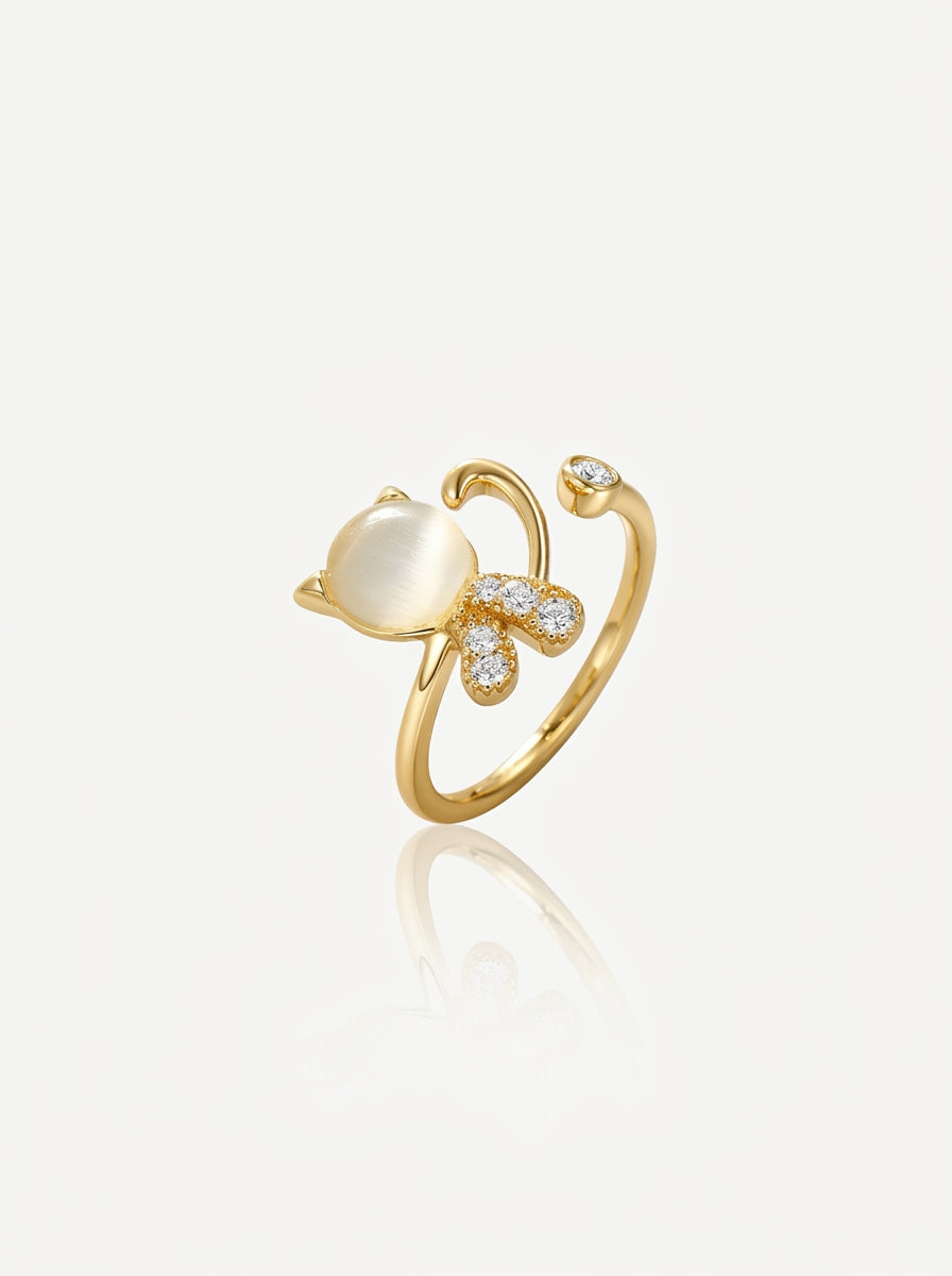 Cat's eye crystal open ring gold front view — solisita