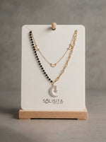 Load image into Gallery viewer, Celestial Star &amp; Moon Layered Necklace Gold Close-Up Detail — Solisita
