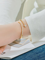 Load image into Gallery viewer, Crystal Heart Wrap Bangle Gold On-Wrist Shot — Solisita
