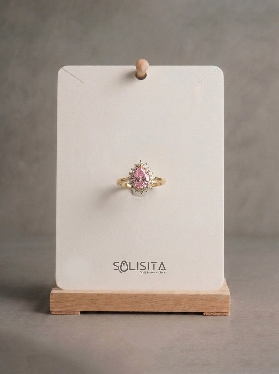 Crystal teardrop halo ring gold close up — solisita
