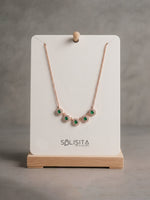 Load image into Gallery viewer, Emerald Green Halo Disc Necklace Gold Close-Up Detail — Solisita
