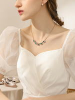 Load image into Gallery viewer, Emerald Green Halo Disc Necklace Gold On-Model Front — Solisita
