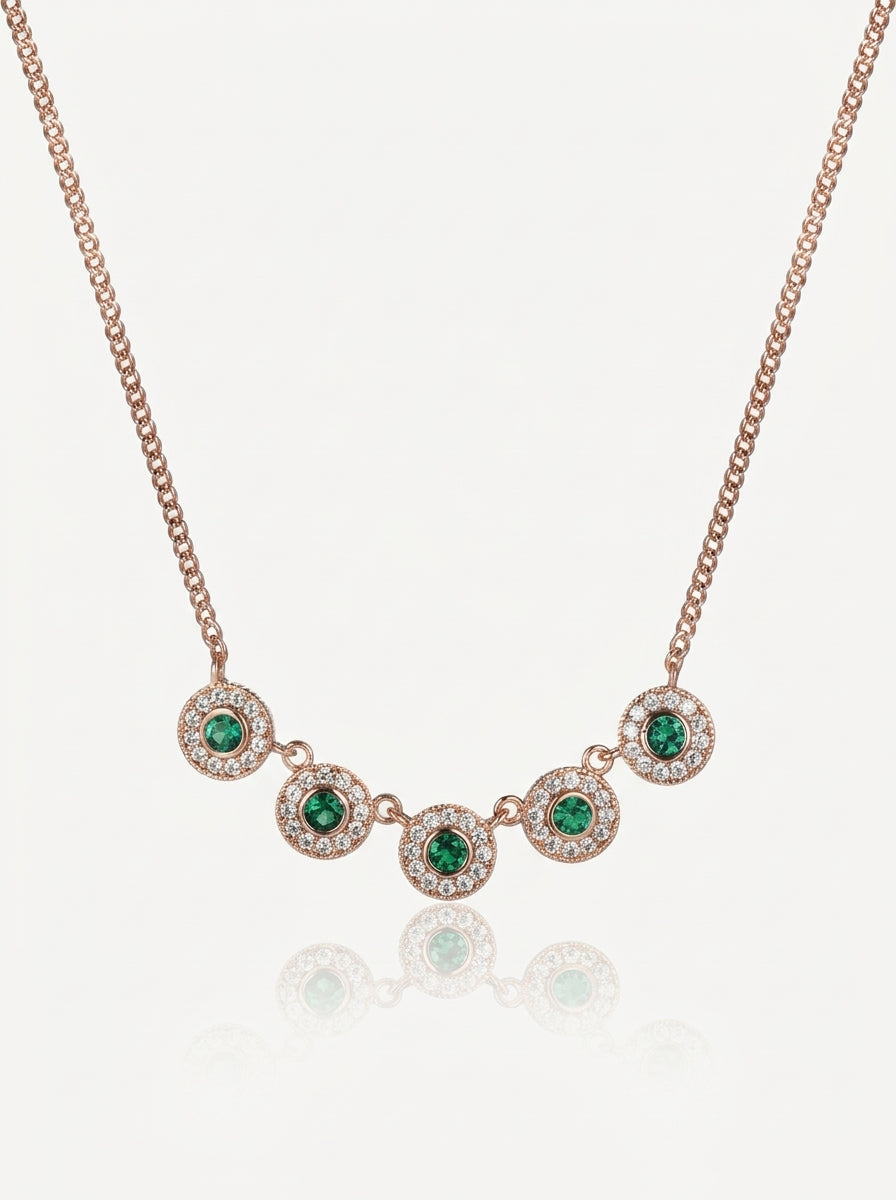 Emerald green halo disc necklace gold front view — solisita