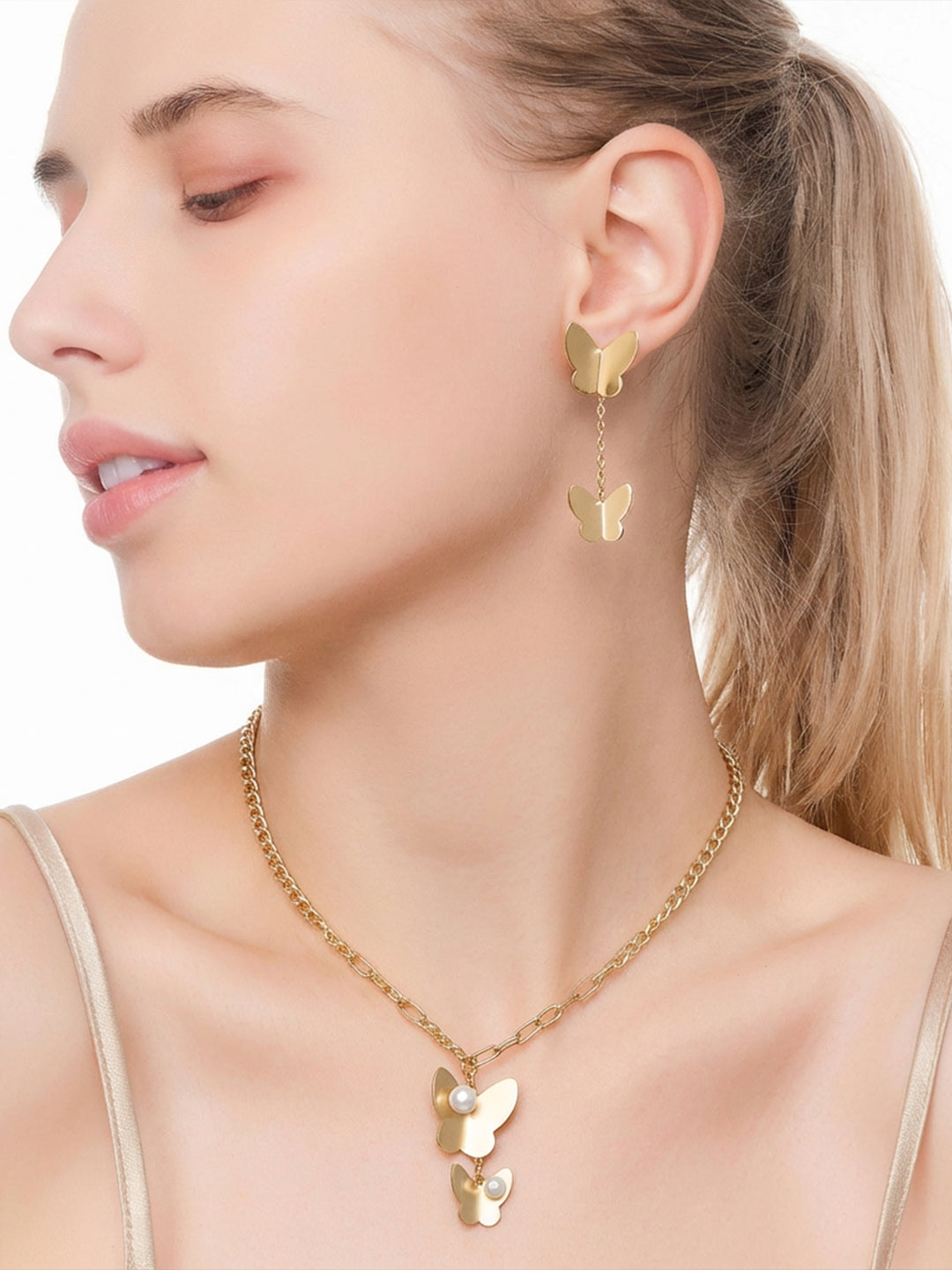 Matte Gold Butterfly & Pearl Asymmetrical Set Side View — Solisita