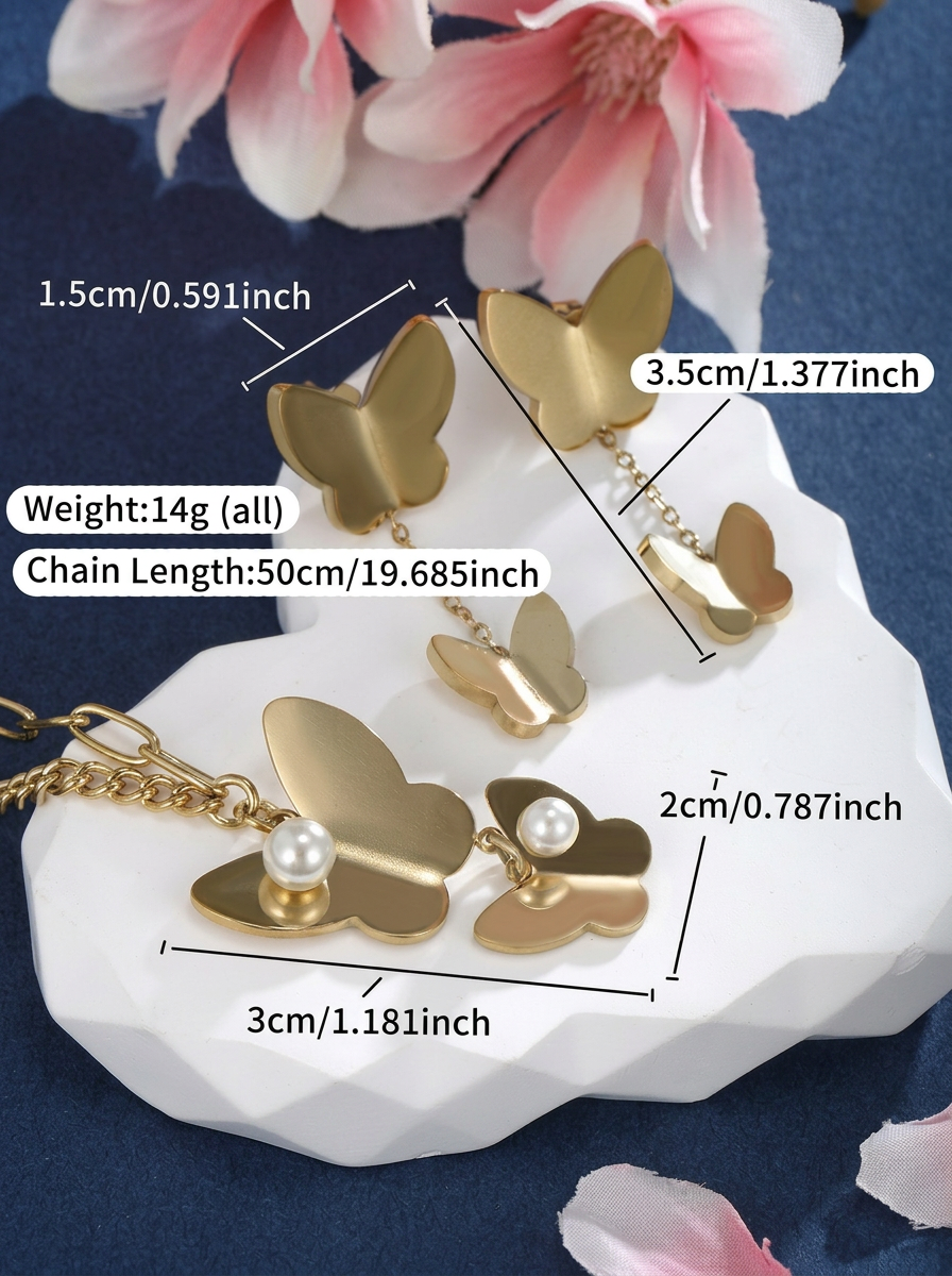 Matte Gold Butterfly & Pearl Asymmetrical Set Flat-Lay — Solisita