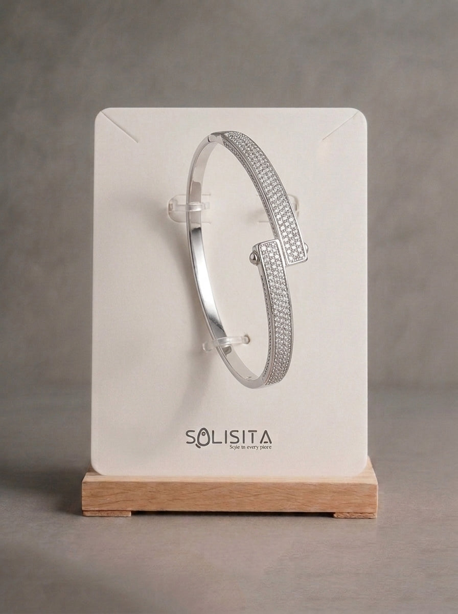 Pavé crystal bar hinged bangle silver on wrist detail — solisita