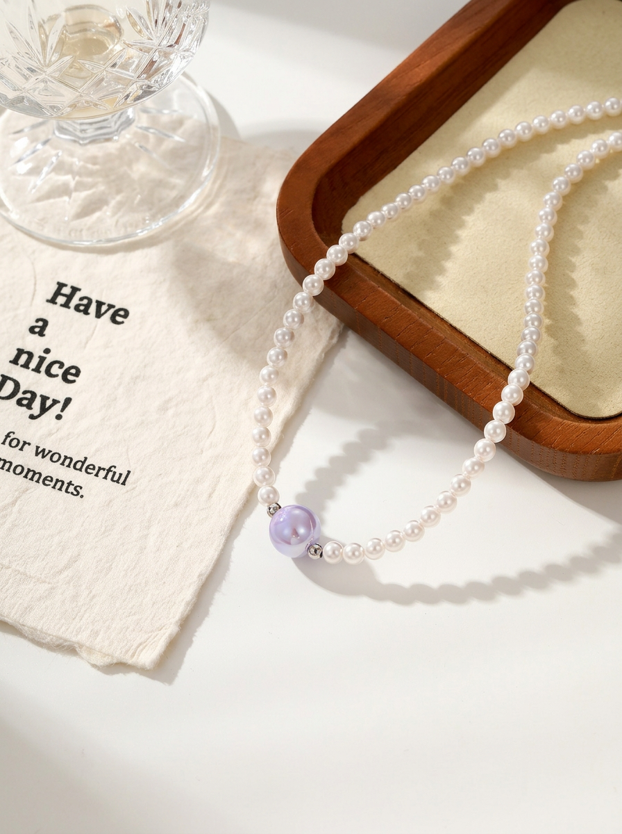 Pearl beaded necklace with coloured centre gold tone angle shot — solisita