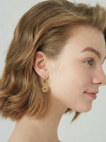 Load image into Gallery viewer, Solar Heart Earrings Gold Side View — Solisita
