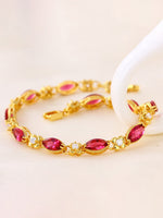Load image into Gallery viewer, Vintage Ruby Marquise Bracelet Gold Angle View — Solisita
