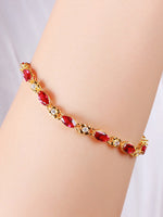 Load image into Gallery viewer, Vintage Ruby Marquise Bracelet Gold On-Wrist Shot — Solisita
